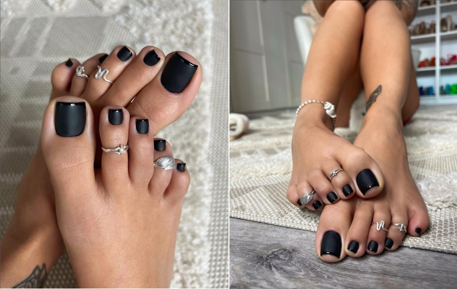 Black pedicure toenails and toe rings